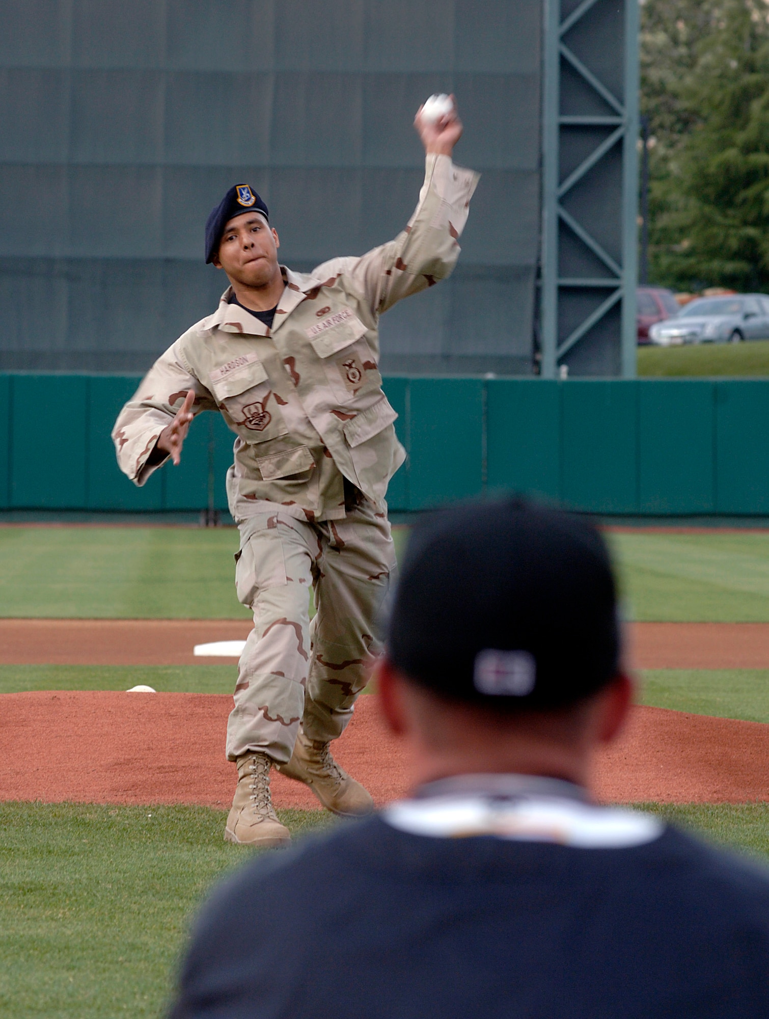 Staff Sgt. Raymond Hardson throws out the first pitch before a local minor league baseball game June 4 during Air Force Week in California. The purpose of Air Force Week is to inform and educate the American public about the importance and roles of the Air Force in America's national defense. Sergeant Hardson is a security forces Airman from Beale Air Force Base, Calif. (U.S. Air Force photo/Tech. Sgt. Larry A. Simmons)
