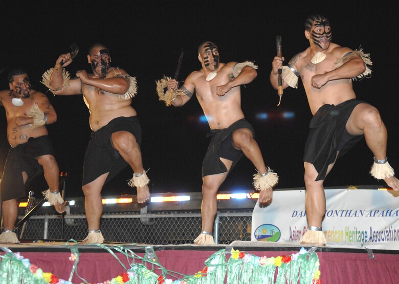 Performers demonstrate a traditional Polynesian group dance during the Asian/Pacific American Heritage Luau at Bama Park here June 1. (U.S. Air Force photo/Senior Airman Christina D. Ponte)