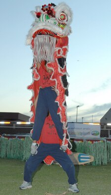 Members of the Tucson Chinese Cultural Center perform a traditional lion dance during the Asian/Pacific American Heritage Luau at Bama Park here June 1. (U.S. Air Force photo/Senior Airman Christina D. Ponte)