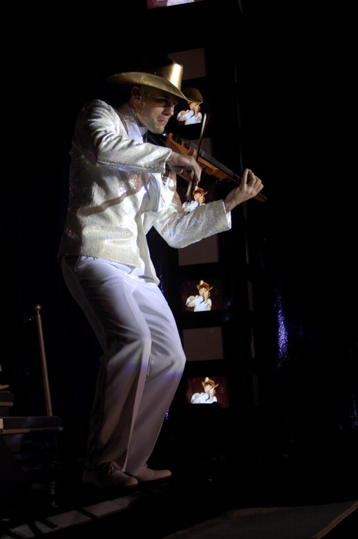 Capt. Alexander Ruiz performs during the 2007 "Fly-by" themed Tops in Blue for Vandenberg Air Force Base, Calif, at the Cabrillo High School auditorium, Vandenberg Village, Calif., on June 2. The violinist and Tops and Blue tour director is a space and missile officer with the 10th Missile Squadron at Malmstrom AFB, Mont. (U.S. Air Force Photo By Airman 1st Class Nichelle Griffiths)