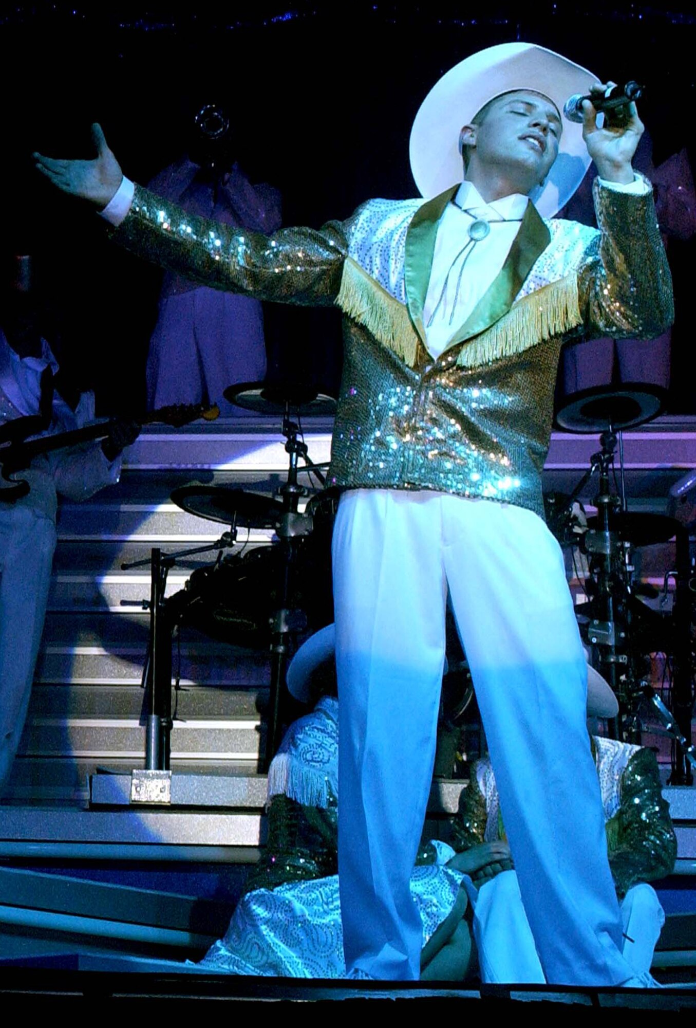 Senior Airman Jonathan Hayden sings during the 2007 "Fly-by" themed Tops in Blue concert at the Cabrillo High School auditorium, Vandenberg Village, Calif., on June 2.  The computer network cryptolographic switching systems journeyman serves with the 609th Air Communications Squadron, Shaw AFB, S.C. (U.S. Air Force Photo by Senior Airman Kristi Emler)