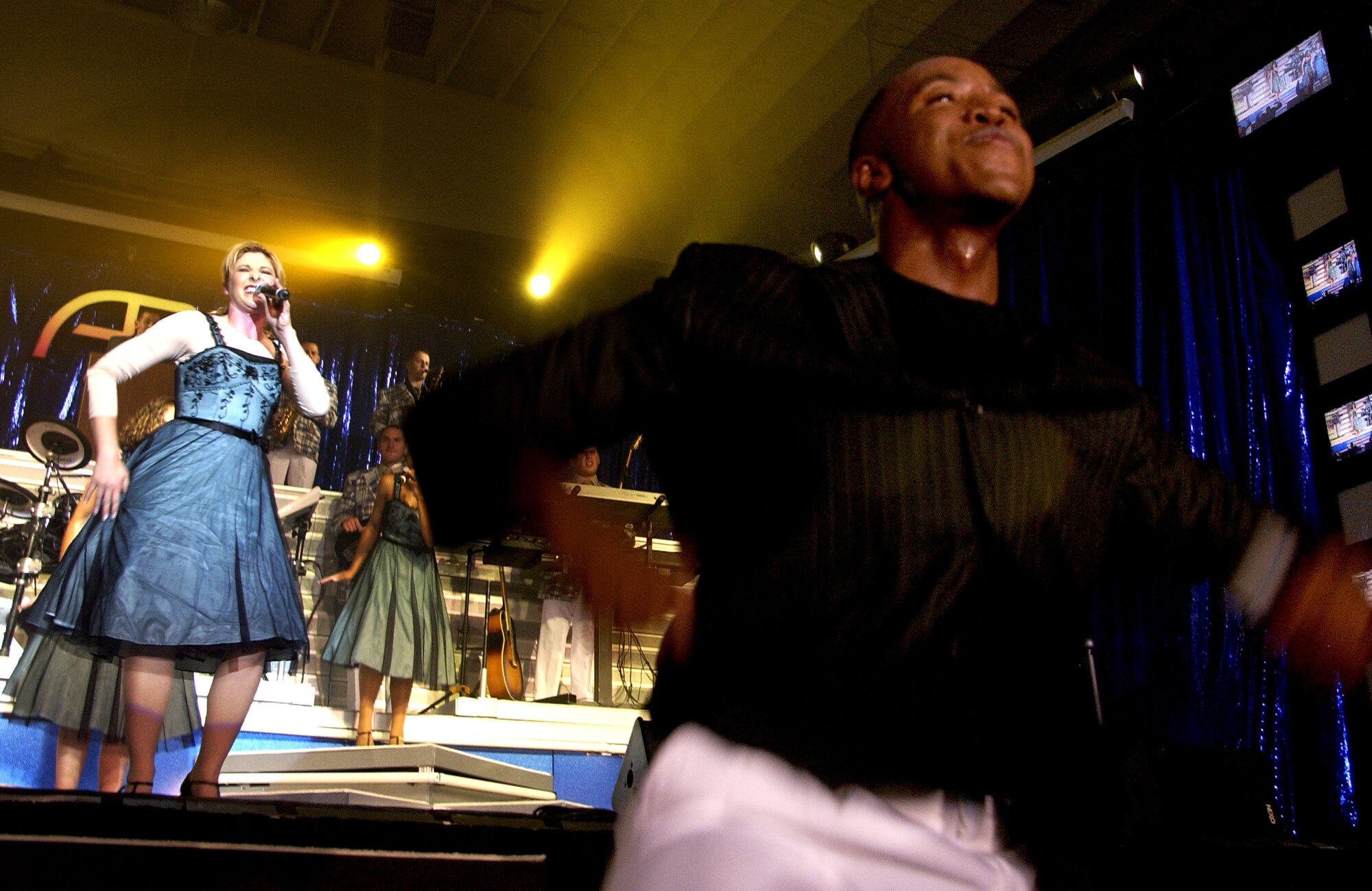 Tops in Blue Airmen perform during the 2007 "Fly-by" themed Tops in Blue concert at the Cabrillo High School auditorium, Vandenberg Village, Calif., on June 2.  The 40-member group showcases music, dance and comedy, all performed by active-duty Airmen who perform 90 minutes of non-stop live entertainment.  (U.S. Air Force Photo by Senior Airman Kristi Emler)
