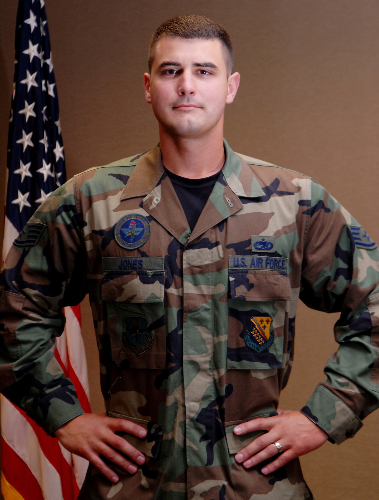 Staff Sgt. Bobby Jones,  373rd Training Squadron, Detachment 4 crew chief instructor, rescued a sleeping man from a fire recently was vacationing in Hot Springs, Ark. Sergeant Jones received a 314th Airlift Wing commander's coin and has been approved to receive an Air Force Commendation medal for his efforts. (U.S. Air Force photo by Airman 1st Class Steele Britton)