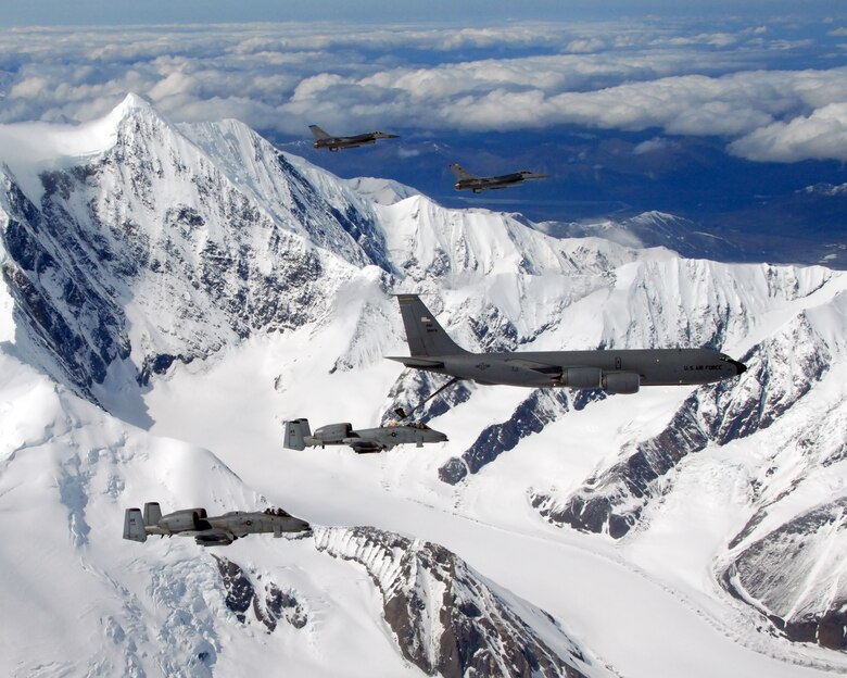 A KC-135R Stratotanker flies in formation with two F-16 Fighting Falcons from the 18th Fighter Squadron and two A-10 Wathog IIs from the 355th FS May 29 near Eielson Air Force Base, Alaska. The five aircraft assigned to Eielson AFB flew in formation for the last time due to the deactivation of the 355th FS and the 18th FS. The tanker is assigned to the Alaska Air National Guard's 168th Air Refueling Wing. The KC-135R along with tankers from Grand Forks AFB, N.D., and MacDill AFB, Fla., are providing air refueling support to aircraft for the joint exercise Red Flag-Alaska, lasting through June 8. (U.S. Air Force photo/Master Sgt. Rob Wieland)