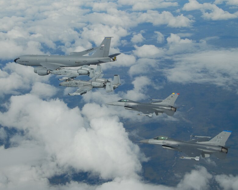 A KC-135R Stratotanker flies in formation with two F-16 Fighting Falcons from the 18th Fighter Squadron and two A-10 Warthog IIs from the 355th FS May 29 near Eielson Air Force Base, Alaska. The five aircraft assigned to Eielson AFB flew in formation for the last time due to the deactivation of the 355th FS and 18th FS. The tanker is assigned to the Alaska Air National Guard's 168th Air Refueling Wing. The KC-135R along with tankers from Grand Forks AFB, N.D., and MacDill AFB, Fla., are providing air refueling support to aircraft for the joint exercise Red Flag-Alaska, lasting through June 8. (U.S. Air Force photo/Master Sgt. Rob Wieland)