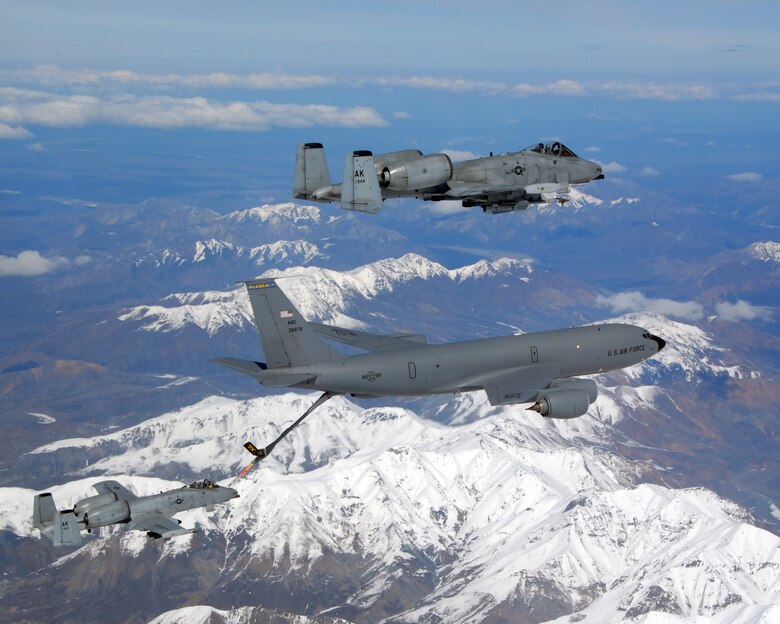 A KC-135R Stratotanker flies in formation with two A-10 Warthog IIs from the 355th Fighter Squadron May 29 near Eielson Air Force Base, Alaska. The three aircraft assigned to Eielson AFB flew in formation for the last time due to the deactivation of the 355th FS and 18th FS. The tanker is assigned to the Alaska Air National Guard's 168th Air Refueling Wing. The KC-135R along with tankers from Grand Forks AFB, N.D., and MacDill AFB, Fla., are providing air refueling support to aircraft for the joint exercise Red Flag-Alaska, lasting through June 8. (U.S. Air Force photo/Master Sgt. Rob Wieland)