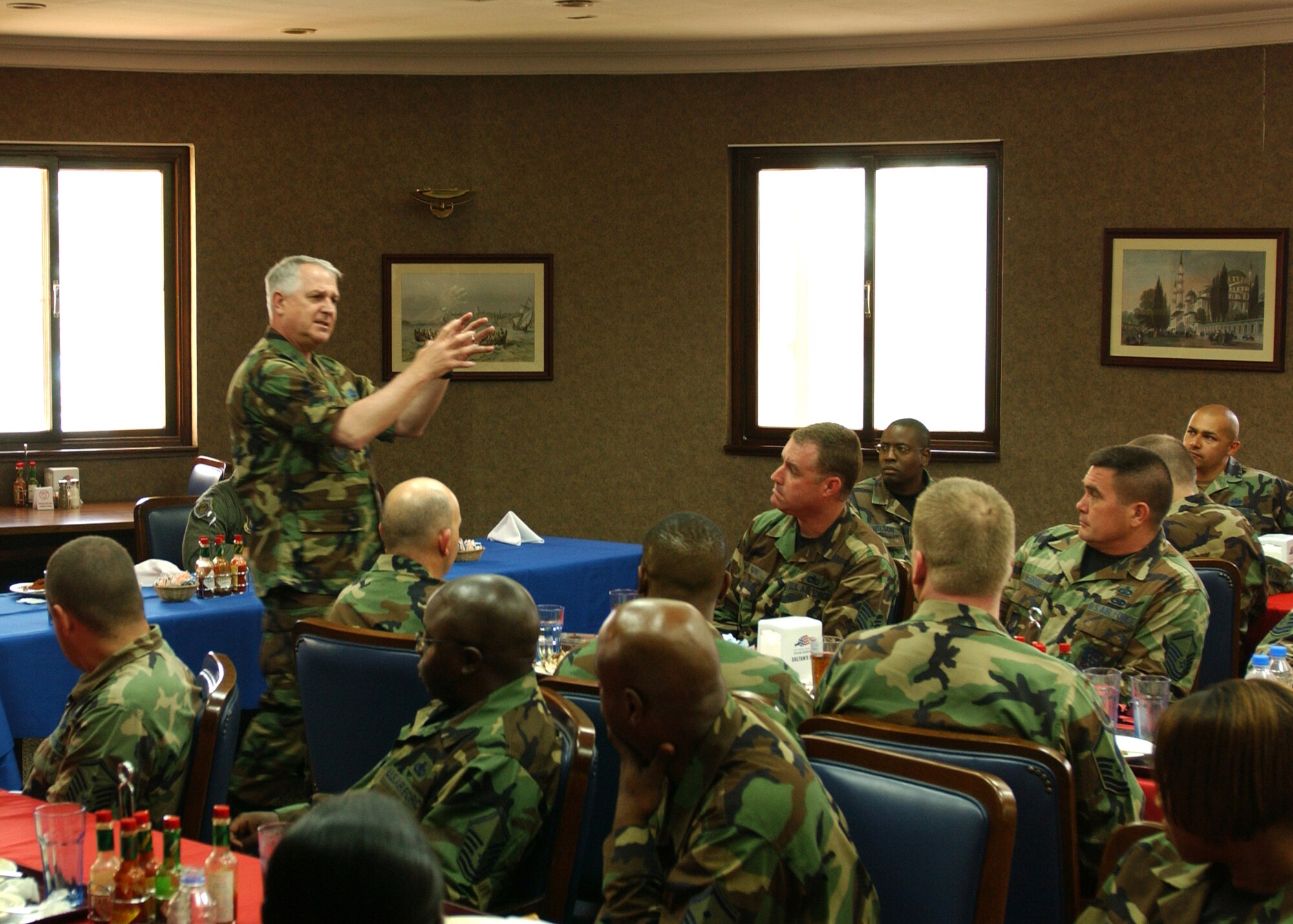 Maj. Gen. Paul Fletcher 3rd Air Force Vice Commander, talks to a group of Incirlik's Sergeants on budget issues for 2007 inside the Sultans Inn June 6. One Master Sergeant stated that some shops at Incirlik had trouble sending troops TDY due to the recent budget cuts. (U. S. Air Force photo by Airman 1st Class Timothy A. Taylor)           