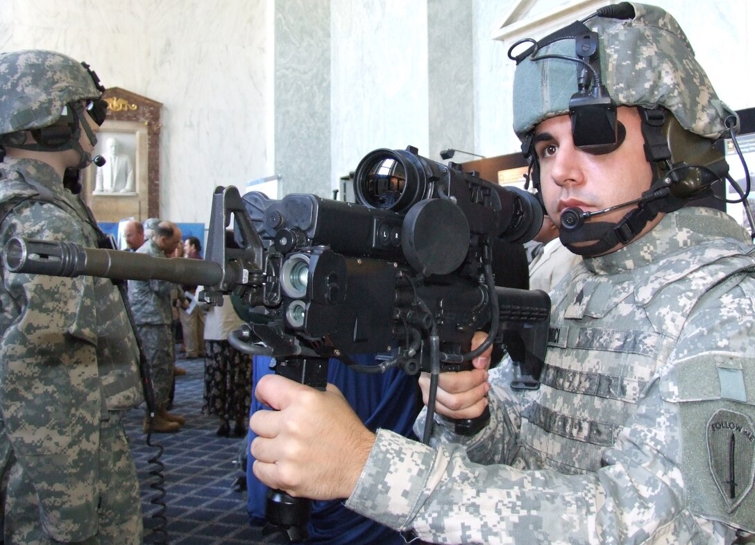 Army Sgt. Philip Morici models the improved Land Warrior individual soldier combat system at a military equipment exhibit held in the Rayburn House Office Building in Washington, D.C., June 6, 2007. Photo by Gerry J. Gilmore, American Forces Press Service