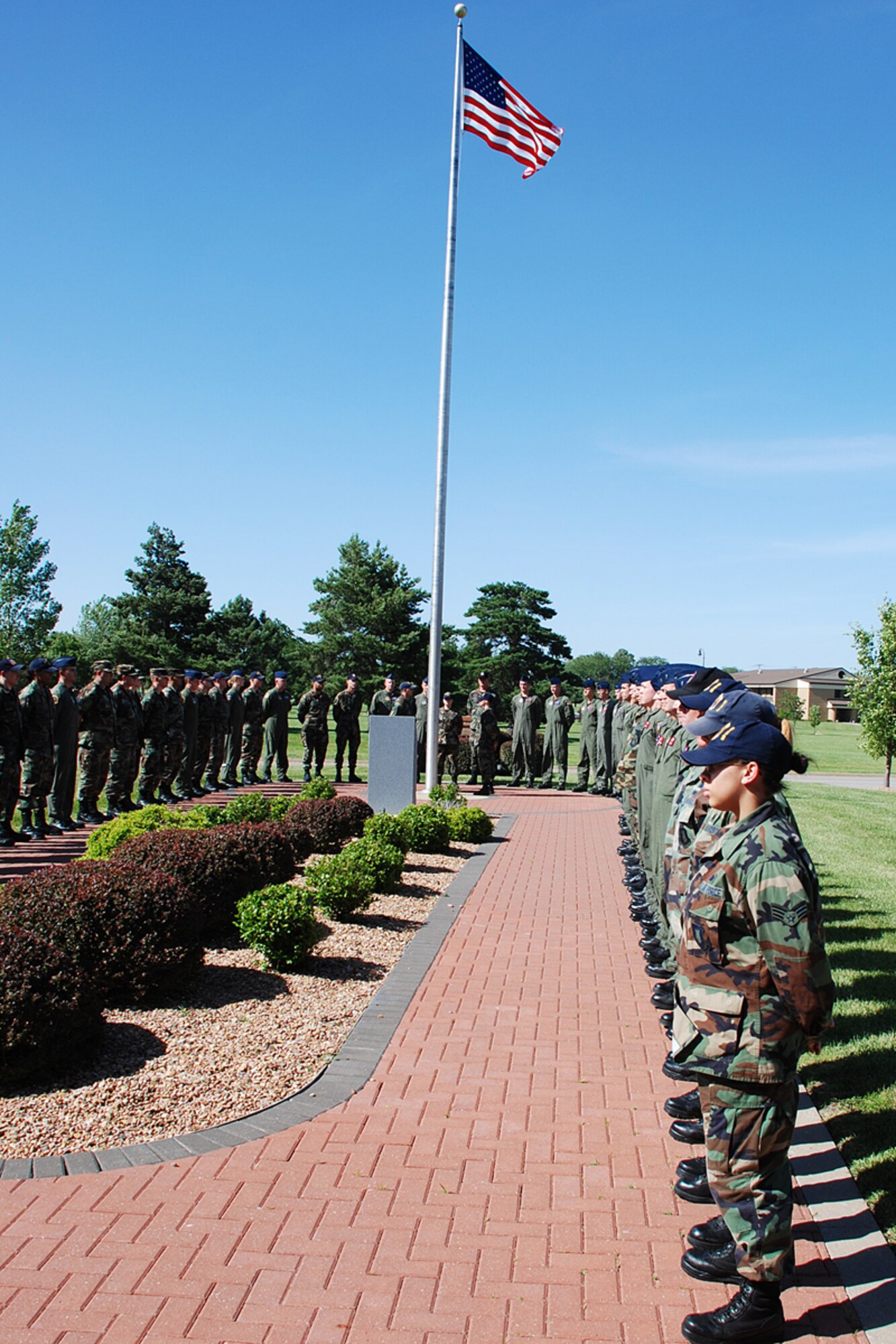 The 22nd Operations Group performs a Retreat ceremony June 7 in front of Bldg.1. The OG renders proper respect for the United States flag. -No disrespect should be shown to the flag of the USA. The US flag will never be displayed upside down except as a signal of distress in instances of extreme danger to life or property. The flag should never be carried flat or horizontally, always aloft or free. The flag should never touch anything beneath it such as the ground, floor, water or merchandise. The flag should never be used as wearing apparel, bedding or drapery and when hanged should always be allowed to fall free. The flag should never be fastened, displayed, used or stored in such a manner as to permit it to be easily torn, soiled or damaged in any way. The flag should never be decorated, nor should it have attached to it, any mark, insignia, letter, word, figure, design, picture, or drawing of any nature.  
     
More information showing proper respect the US flag can be found in AFI 34-1201.
(Photo by Airman 1st Class Jessica Lockoski)