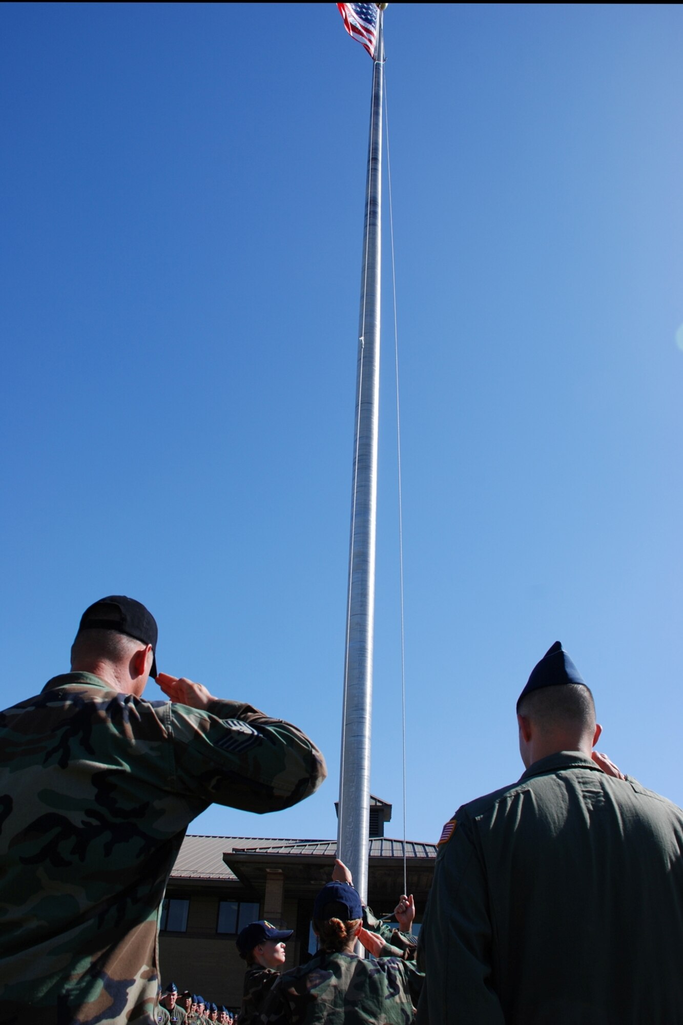 The 22nd Operations Group performs a Retreat ceremony June 7 in front of Bldg. 1. The OG renders proper respect for the United States flag. - No disrespect should be shown to the flag of the USA. The US flag will never be displayed upside down except as a signal of distress in instances of extreme danger to life or property. The flag should never be carried flat or horizontally, always aloft or free. The flag should never touch anything beneath it such as the ground, floor, water or merchandise. The flag should never be used as wearing apparel, bedding or drapery and when hanged should always be allowed to fall free. The flag should never be fastened, displayed, used or stored in such a manner as to permit it to be easily torn, soiled or damaged in any way. The flag should never be decorated, nor should it have attached to it, any mark, insignia, letter, word, figure, design, picture, or drawing of any nature. More information showing proper respect the US flag can be found in AFI 34-1201. (Photo by Airman 1st Class Jessica Lockoski)