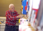 Buck Zehringer, a retired master sergeant who volunteers at the Randolph Dental Clinic, processes and prepares dental records for staff members each morning. (U.S. Air Force photo by Rich McFadden)