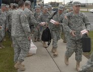 MINOT AIR FORCE BASE, N.D. – Soldiers from the North Dakota National Guard's 164th Engineer Battalion board a 737 aircraft on the flight line here en route to Camp Shelby Miss. prior to being deployed to a forward location in Iraq. The 119 Soldiers will be for approximately a year before returning to the U.S. (U.S. Air Force photo by Senior Airman Christopher Boitz)