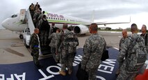 MINOT AIR FORCE BASE, N.D. – U.S. Air Force Lt. Col. Dan Semsel, 5th Logistics Readiness Squadron commander, says farewell to Soldiers from the North Dakota National Guard's 164th Engineer Battalion as they board a 737 aircraft on the flight line here.  More than 100 soldiers departed from Minot AFB en route to Camp Shelby Miss. prior to being deployed to a forward location in Iraq. The Soldiers will be deployed for approximately a year before returning to the U.S. (U.S. Air Force photo by Senior Airman Christopher Boitz)