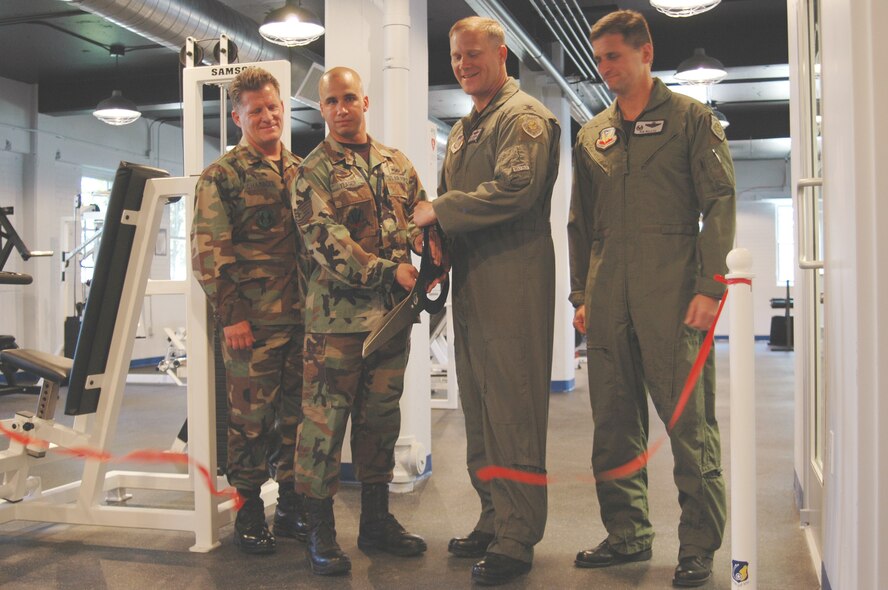 From left to right: Col. Scott Chambers, 75th Air Base Wing commander, Tech. Sgt. Stacey Yeager, assistant civil engineering liaison for the 388th FW, Col. Jeffrey Lofgren, former 388th Operations Group commander, and Col. Robert Beletic, 388th Fighter Wing commander, are all present during the ribbon cutting ceremony to officiate the opening of the pilot gym June 4.
