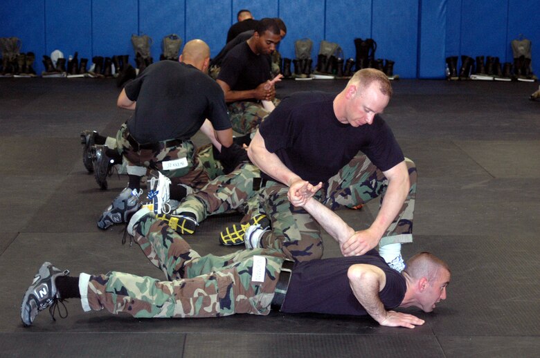 Students in the Air Force Phoenix Raven Course 07-D practice self defense moves as part of a training class for the course May 9, 2007, at the U.S. Air Force Expeditionary Center on Fort Dix, N.J.  The course, taught by the USAF EC's 421st Combat Training Squadron, trains security forces Airmen in everything from self defense to aircraft security.  The Air Force Phoenix Raven Program recently celebrated 10 years of training students. (U.S. Air Force Photo/Tech. Sgt. Scott T. Sturkol)