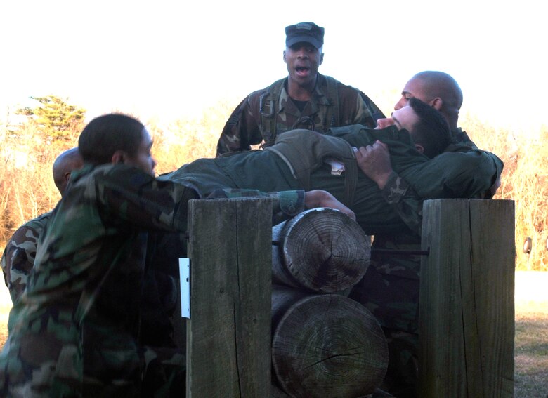 U.S. Air Force Tech. Sgt. Aubrey Vasquez, security forces instructor for the U.S. Air Force Expedtionary Center's 421st Combat Training Squadron, shouts out instructions to Air Force and Navy students participating in the combat first aid portion of the Air Force Phoenix Raven Course 06-D March 27, 2006, on Fort Dix, N.J.  Sergeant Vasquez is one of several instructors assigned to the 421st to teach the rigorous Raven course.  The Raven course recently celebrated 10 years in training having been established in 1997.  (U.S. Air Force Photo/Tech. Sgt. Scott T. Sturkol)