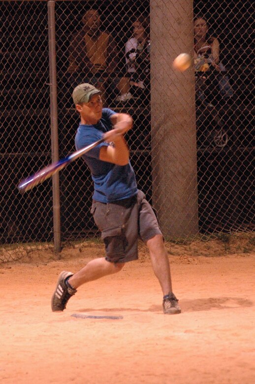 Airman Addison Brown, 403rd Maintanence Group, takes a swing at the ball during one of the intramural softball games. Brown is new to the unit  "We all come down to the same level with the same goal in a sport environment,"says Raye Johnson, 403rd mission support flight and assistant coach. " The team builds morale and gives everybody a chance to get to meet people from other parts of the unit." (US Air Force Photo by Senior Airman Tabitha Spinks)