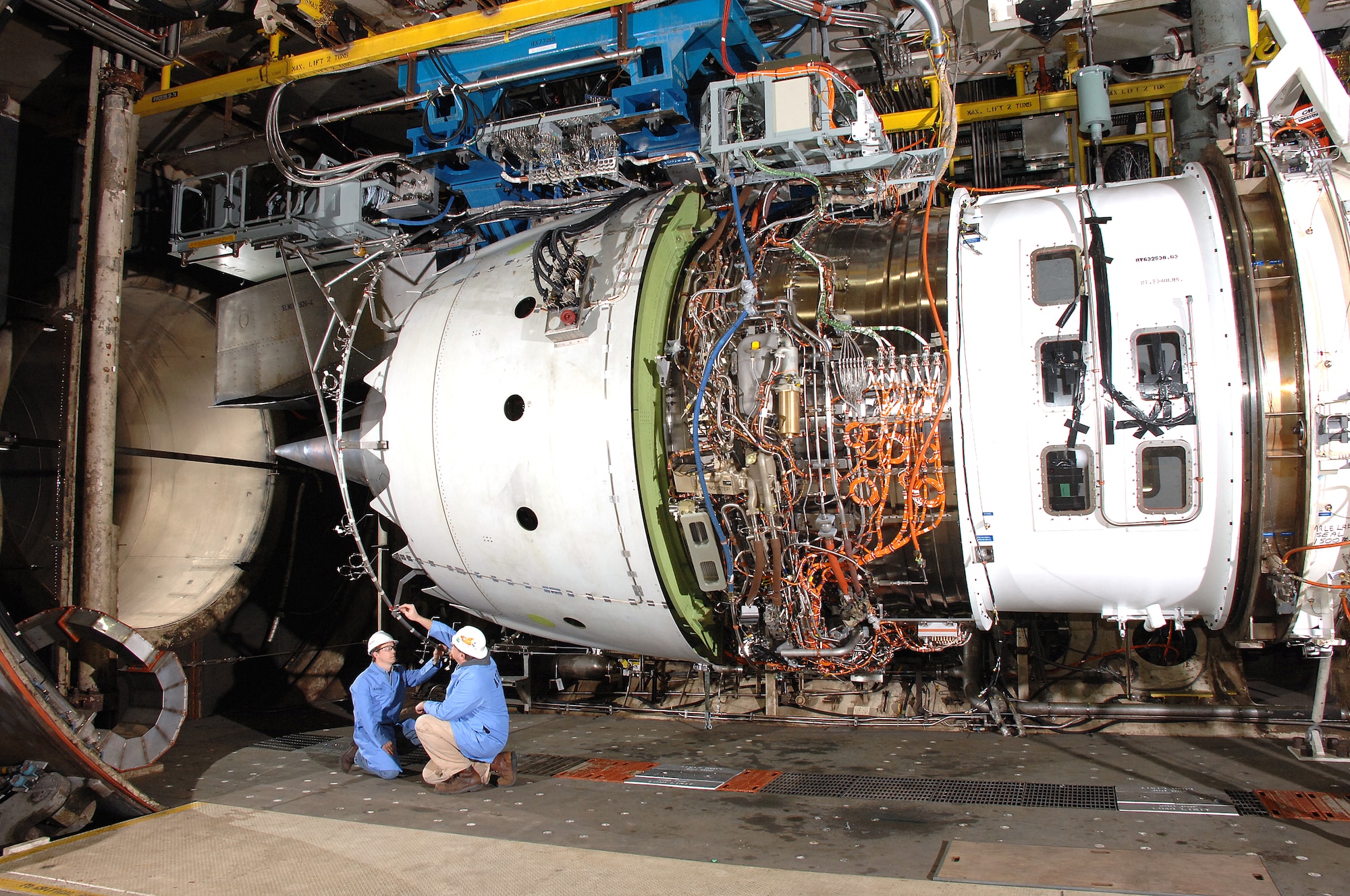 Aerospace Testing Alliance Outside Machinists Danny Haddon and James Cossey inspect the Rolls-Royce Trent 1000 engine in the Aeropropulsion Systems Test Facility at Arnold Engineering Development Center at Arnold Air Force Base, Tenn., prior to testing. (Photo by David Housch)