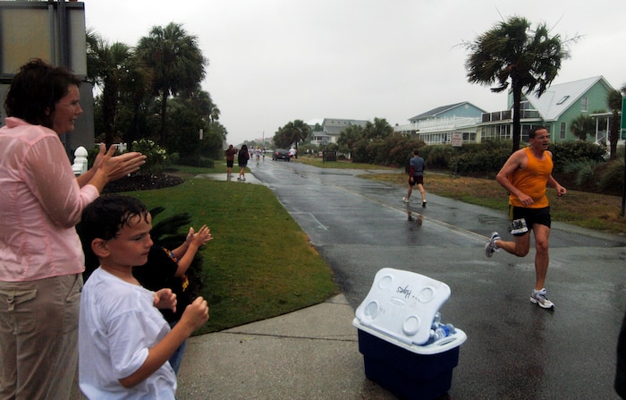 Bill Foster, 437th Mission Support Squadron, runs in the ALS New Hope 5K Beach Run at Isle Palms Beach June 2.  Even though the rain was steadily coming down, his family came out to support him during the run.  (U.S. Air Force photo/ Staff Sgt. April Quintanilla)