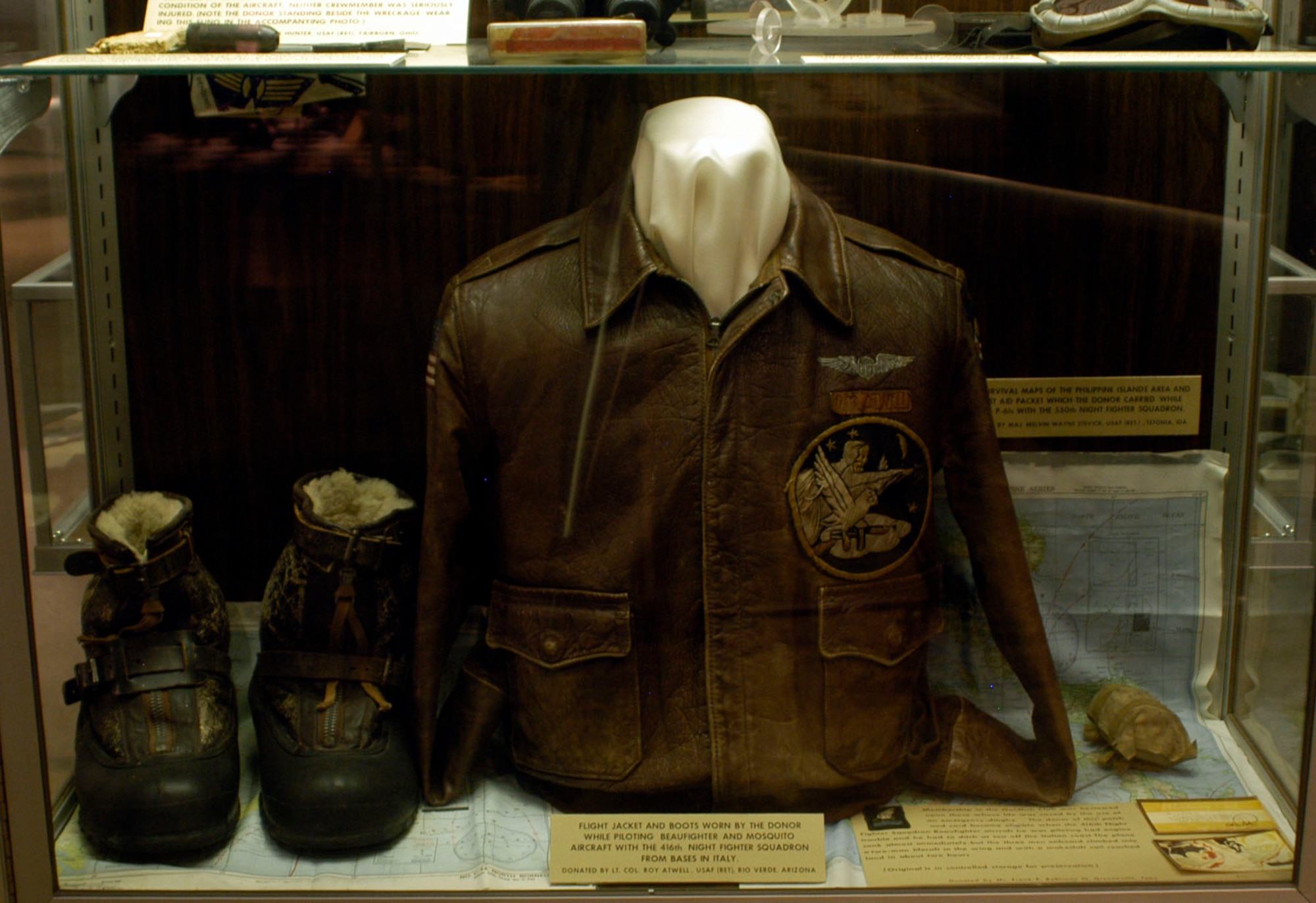 DAYTON, Ohio -- Flight jacket and boots worn by the donor while piloting the Beaufighter and Mosquito aircraft with the 416th Night Fighter Squadron from bases in Italy. Items on display in the World War II Gallery at the National Museum of the U.S. Air Force were donated by Lt. Col. (Ret.) Roy Atwell. (U.S. Air Force photo) 