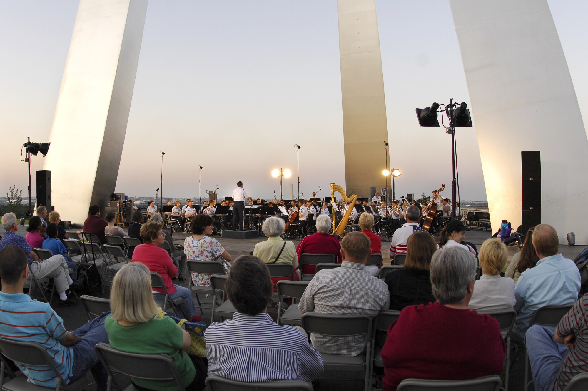 Retired Col. Arnold D. Gabriel, U.S. Air Force Band conductor emeritus, lead the Band in an outdoor concert at the Air Force Memorial June 6. The program, which paid homage to the D-Day invasion, June 6, 1944, included “Hymn to the Fallen,” from “Saving Private Ryan” by Hollywood film composer and U.S. Air Force alumnus John Williams. Colonel Gabriel served as commander of the Band from 1964-1985. Prior to his commissioning, he served as a machine gunner with the famed 29th Infantry Division during World War II, landing on Omaha Beach on D-Day. He was twice awarded the Bronze Star and earned the French Croix de Guerre. (U.S Air Force photo by Airmen 1st Class Alexandre Montes)  