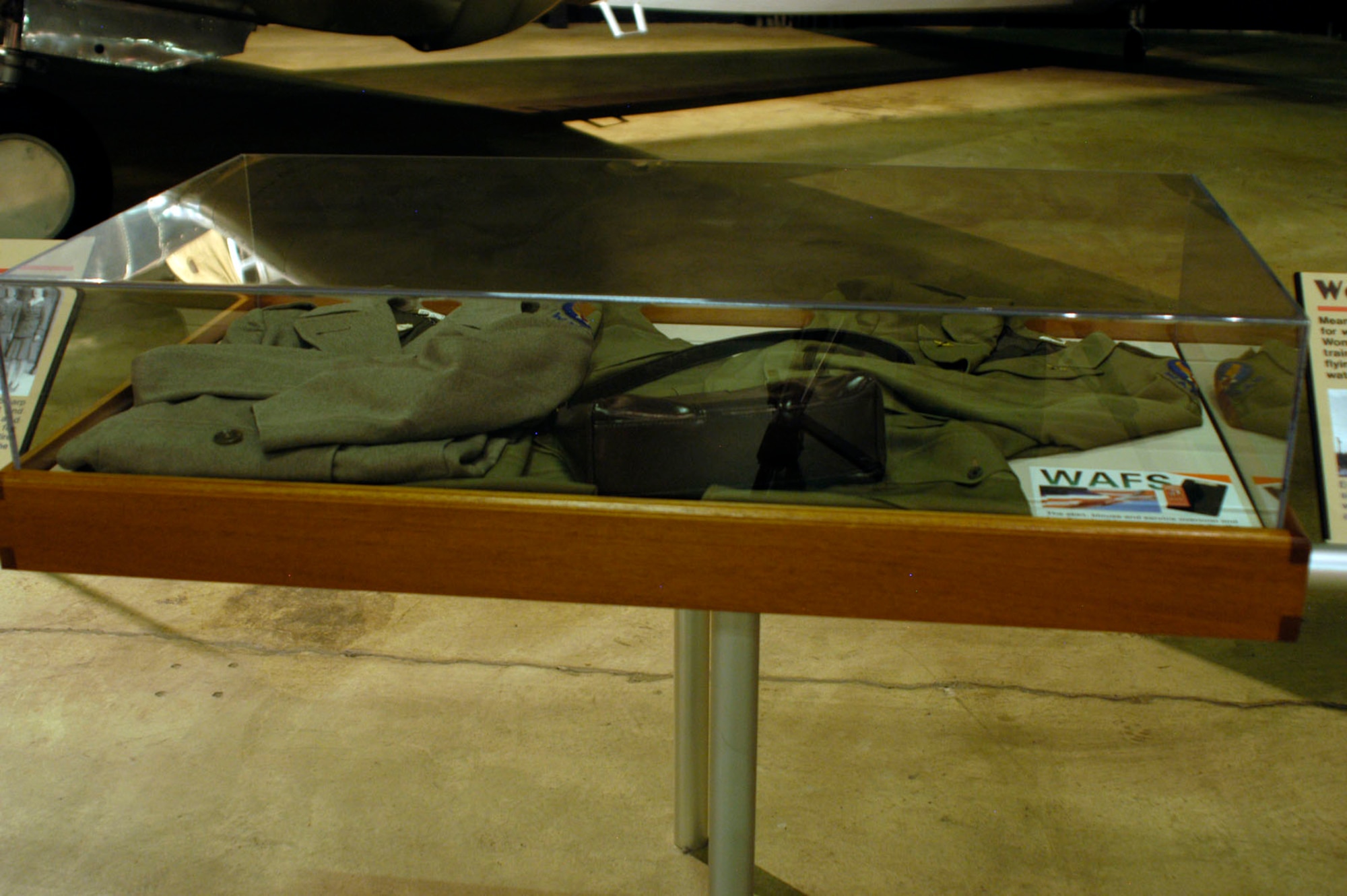 DAYTON, Ohio -- This skirt, blouse, service overcoat and handbag in the World War II Gallery at the National Museum of the U.S. Air Force were worn by the donor while serving as a WAFS pilot. The items were donated by Delphine Bohn of Amarillo, Texas. (U.S. Air Force photo)