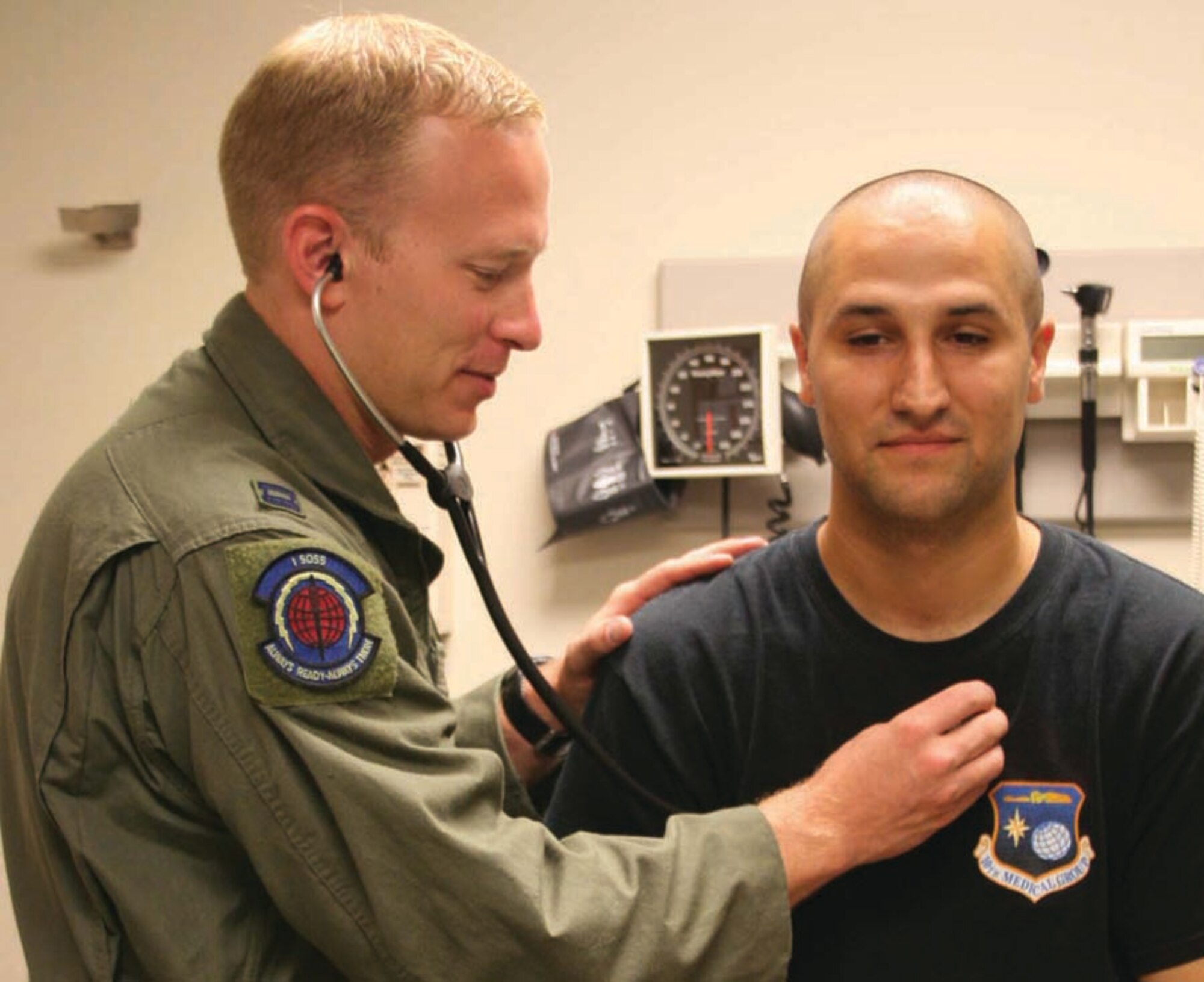 Capt. Ryan Freeland, a flight doc with the 1st Special Operations Support Squadron examines a patient recently. He was selected as the Air Force Flight Surgeon of the Year for 2006. (U.S. Air Force photo by Staff Sgt. Mareshah Haynes)