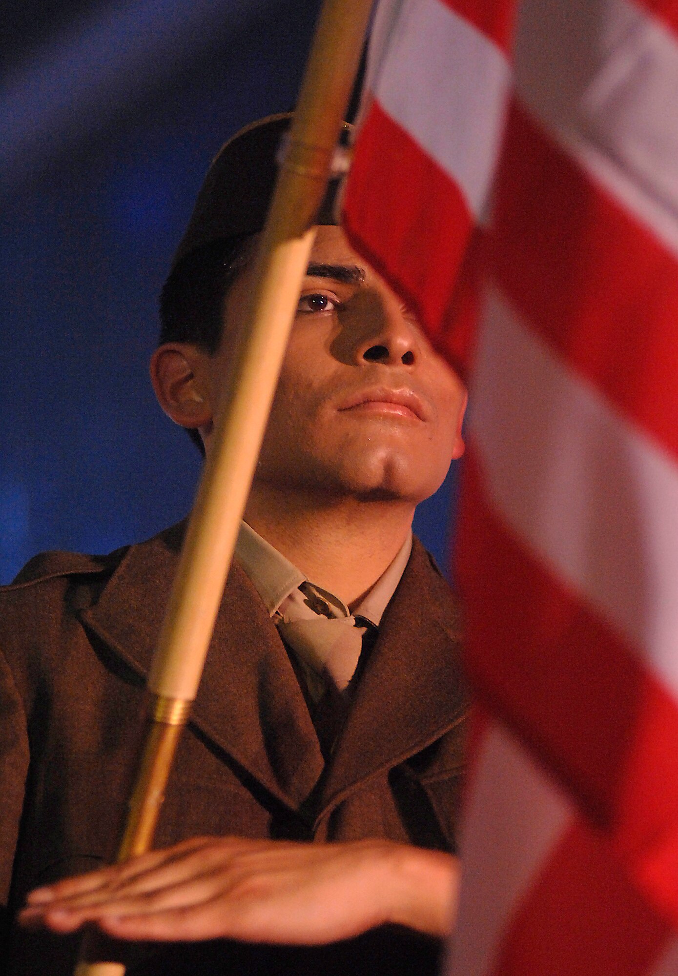 Senior Airman Rick Rosales holds the American Flag during a performance with Tops in Blue as part of Air Force Week June 5 at the Radisson Hotel Sacramento, Calif. Tops in Blue is the Air Force's premier entertainment group that performs for audiences around the globe. (U.S. Air Force photo/Tech. Sgt. Larry A. Simmons)

