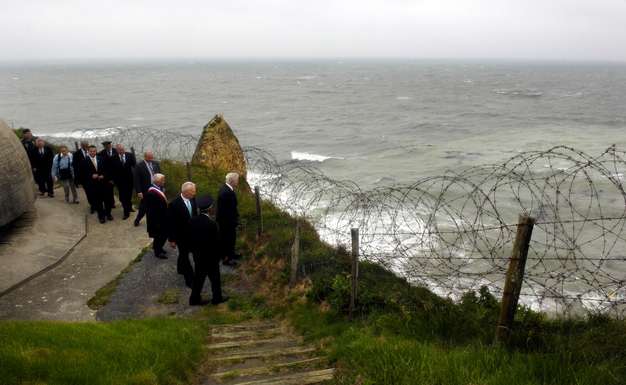 Secretary of Defense Robert M. Gates looks out over Omaha beach at Point-du-Hoc on the 63rd Anniversary of D-Day June 6 in Normandy, France. During World War II, rangers assulted the beaches at Point-du-Hoc and scaled the 100-meter-high cliffs to defeat the enemy for the cause of freedom. (Defense Department photo/Cherie A. Thurlby)