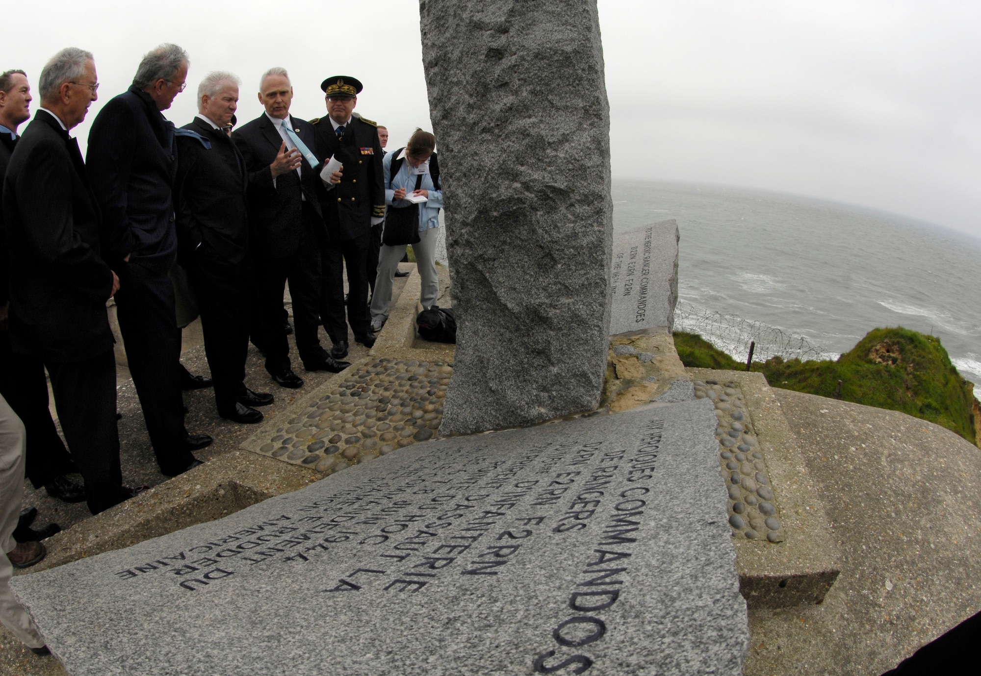 Secretary of Defense Robert M. Gates tours Point-du-Hoc on the 63rd Anniversary of D-Day June 6 in Normandy, France. During World War II, rangers assulted the beaches at Point-du-Hoc and scaled the 100-meter-high cliffs to defeat the enemy for the cause of freedom. (Defense Department photo/Cherie A. Thurlby) 
