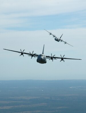 Two of the Air Force's newest airlifters the C-130J-30 fly in formation during a training mission. Flown by Citizen Airmen of the 815th Airlift Squadron, the C-130J-30 aircraft make formation flying easier for aircrews promoting efficiency even in adverse conditions due to the Heads-Up Displays which allow pilots to view essential flight information while never taking their eyes off the outside environment. These aircraft are assigned to Air Force Reserve Command's 403rd Wing. (U.S. Air Force Photo/Maj. Chad Gibson)