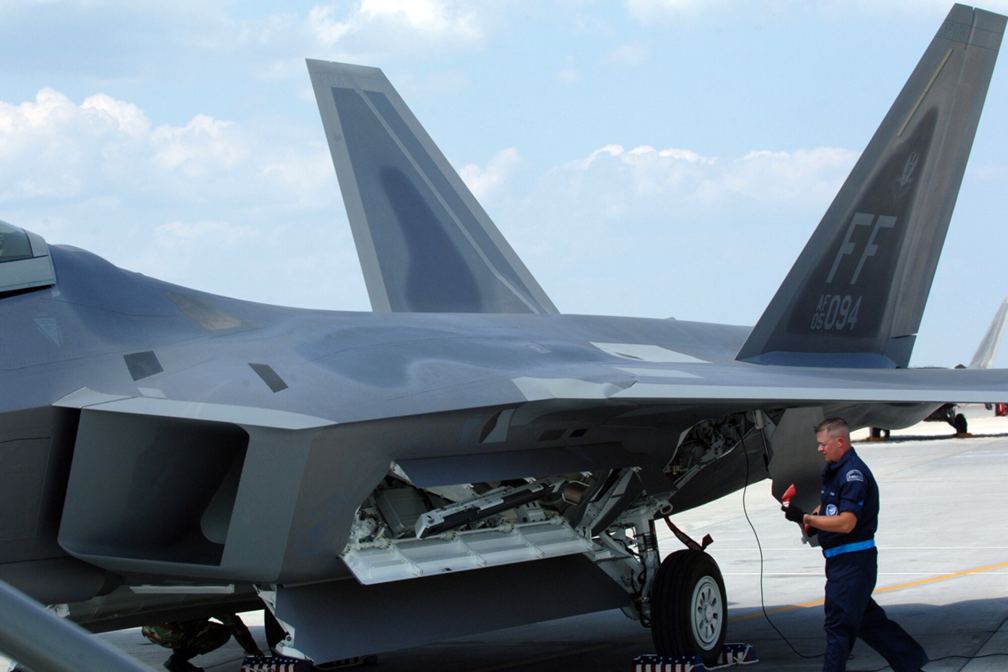 Staff Sgt. Michael Volosky, 1st Aircraft Maintenance Squadron duty title, runs analysis on Langley’s newest F-22A Raptor here June 5. The Raptor, tail number 094, was flown in by Lt. Col. Kevin Fesler, 94th Fighter Squadron commander, and will serve as the flagship for the 94th FS, representing the Spads during deployments, air shows and tours. (U.S. Air Force photo/Airman 1st Class Giang Nguyen)