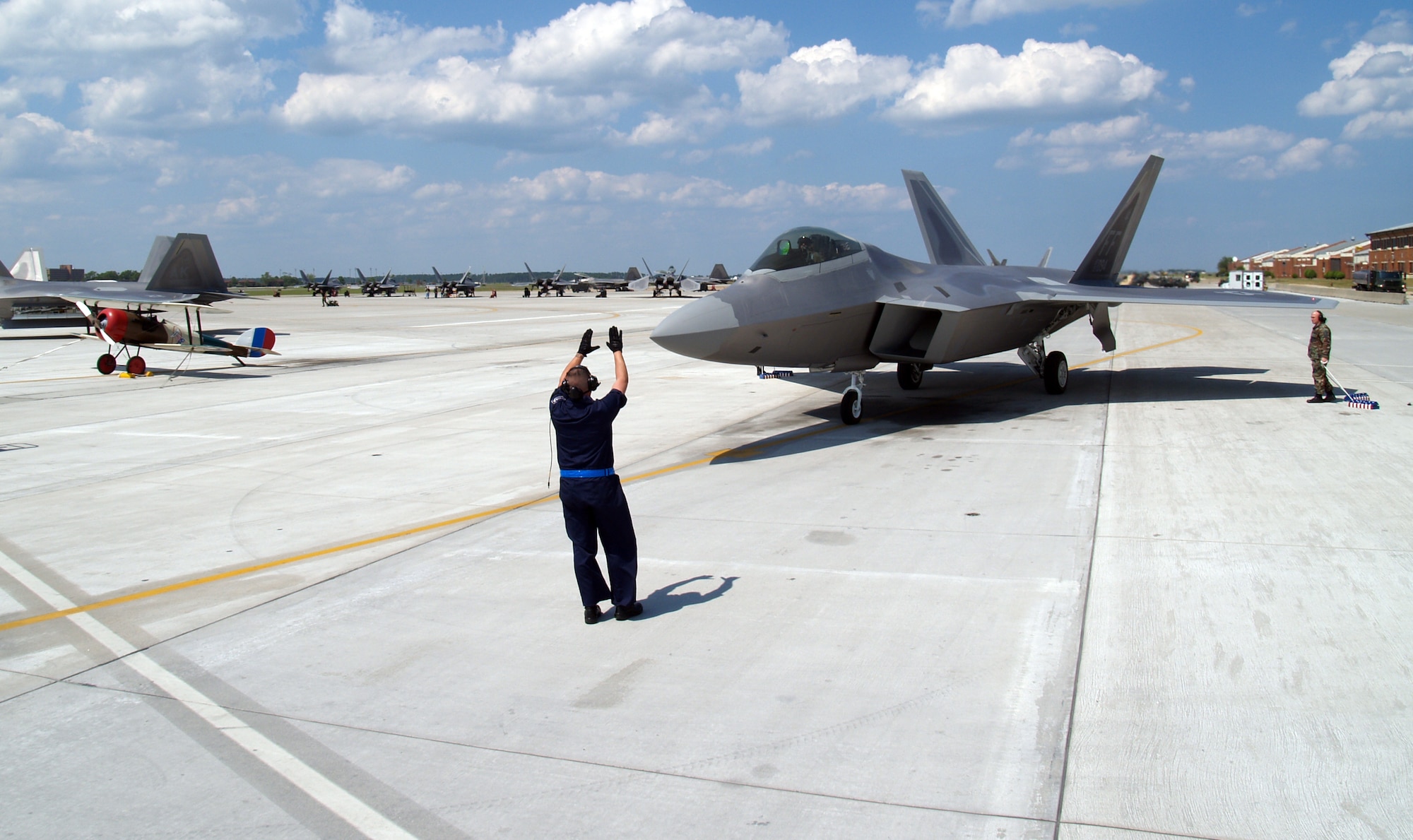 Staff Sgt. Michael Volosky, 1st Aircraft Maintenance Squadron dedicated crew chief, taxis in Langley’s newest F-22A Raptor, tail number 094, piloted by Lt. Col. Kevin Fesler, 94th Fighter Squadron commander. Tail number 094 will serve as the squadron’s flagship and represent the Spads during deployments, air shows and tours. (U.S. Air Force photo/Tech. Sgt. John Ferrara)