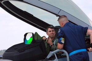 Lt. Col. Kevin Fesler, 94th Fighter Squadron commander, and Staff Sgt. Michael Volosky, 1st Aircraft Maintenance Squadron dedicated crew chief, speak briefly after the Spad commander landed Langley’s newest F-22A Raptor here June 5. Tail number 094, which will serve as the flagship for the 94th FS and AMU, will represent the Spads during deployments, air shows and tours. (U.S. Air Force photo/Airman 1st Class Giang Nguyen)