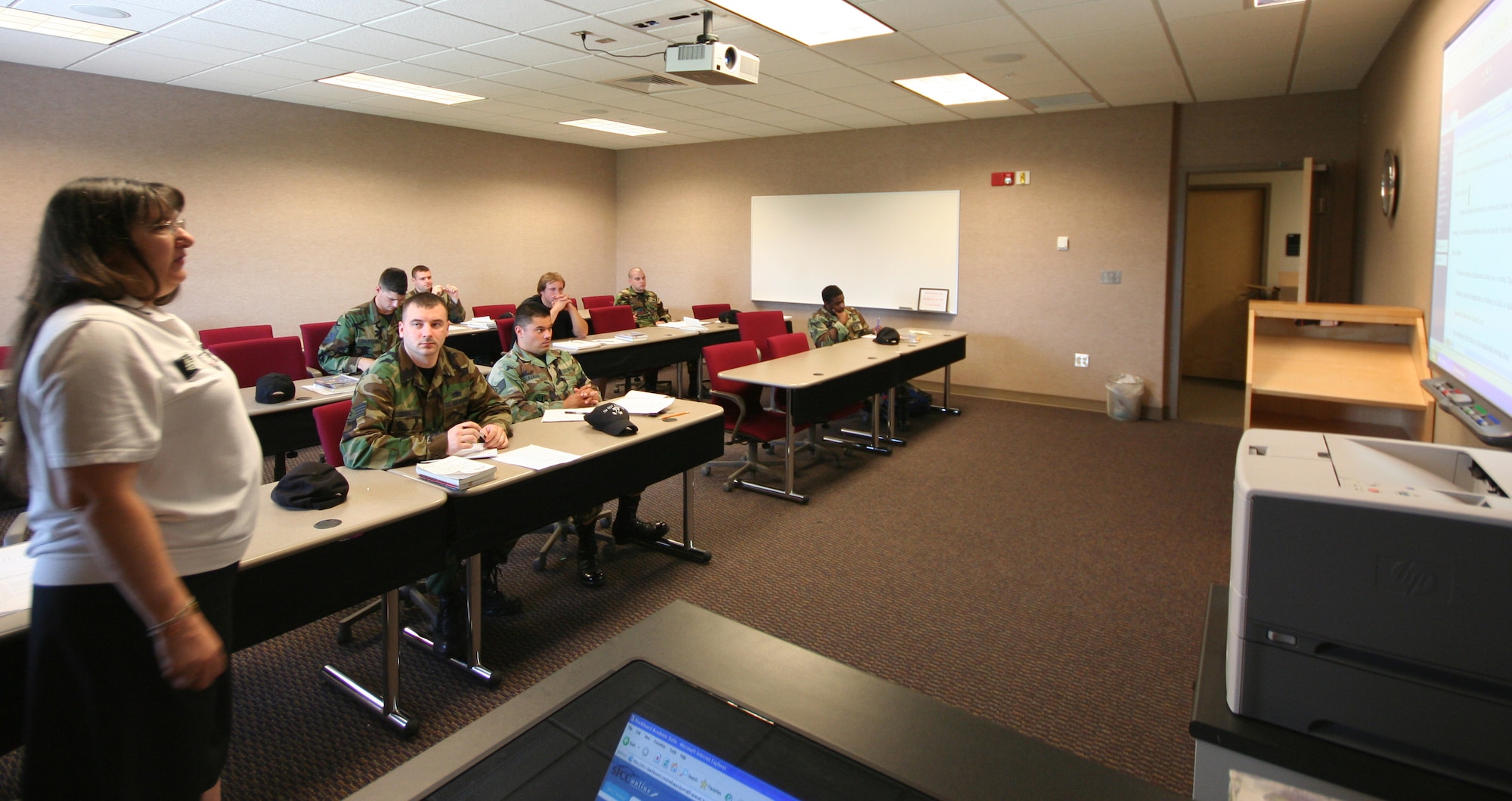 Marge Sokolowski, State Fair Community College, teaches English Composition to members of team Whiteman June 6 at the Professional Development Center. (U.S. Air Force photo/Airman 1st Class Stephen Linch)