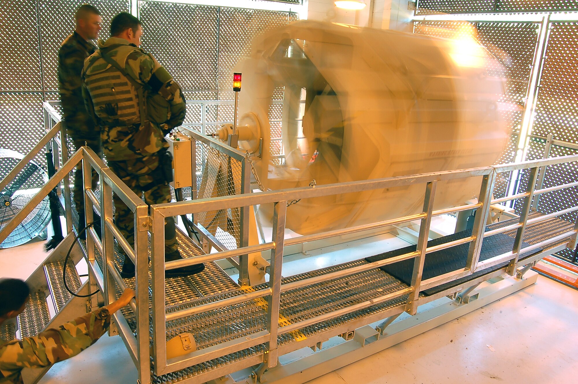 Members of Moody Air Force Base’s 822nd Security Forces Squadron observe training in the Humvee egress assistance trainer, or HEAT, April 3 at the 820th Security Forces Group Training and Technology Center here. The HEAT realistically simulates a vehicle rollover, allowing crew members to prepare for a crisis in a safe environment. (U.S. Air Force photo by Tech. Sgt. Parker Gyokeres)