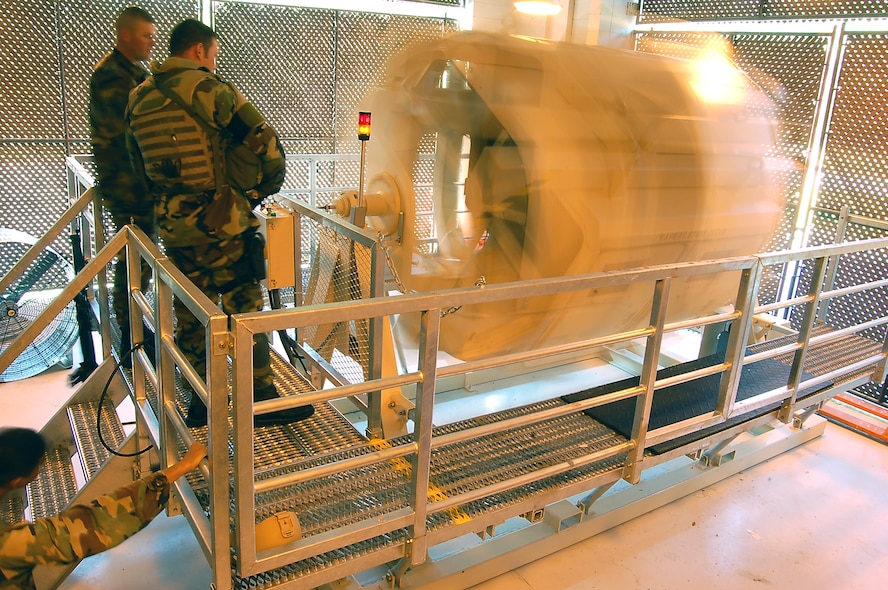 Members of Moody Air Force Base’s 822nd Security Forces Squadron observe training in the Humvee egress assistance trainer, or HEAT, April 3 at the 820th Security Forces Group Training and Technology Center here. The HEAT realistically simulates a vehicle rollover, allowing crew members to prepare for a crisis in a safe environment. (U.S. Air Force photo by Tech. Sgt. Parker Gyokeres)