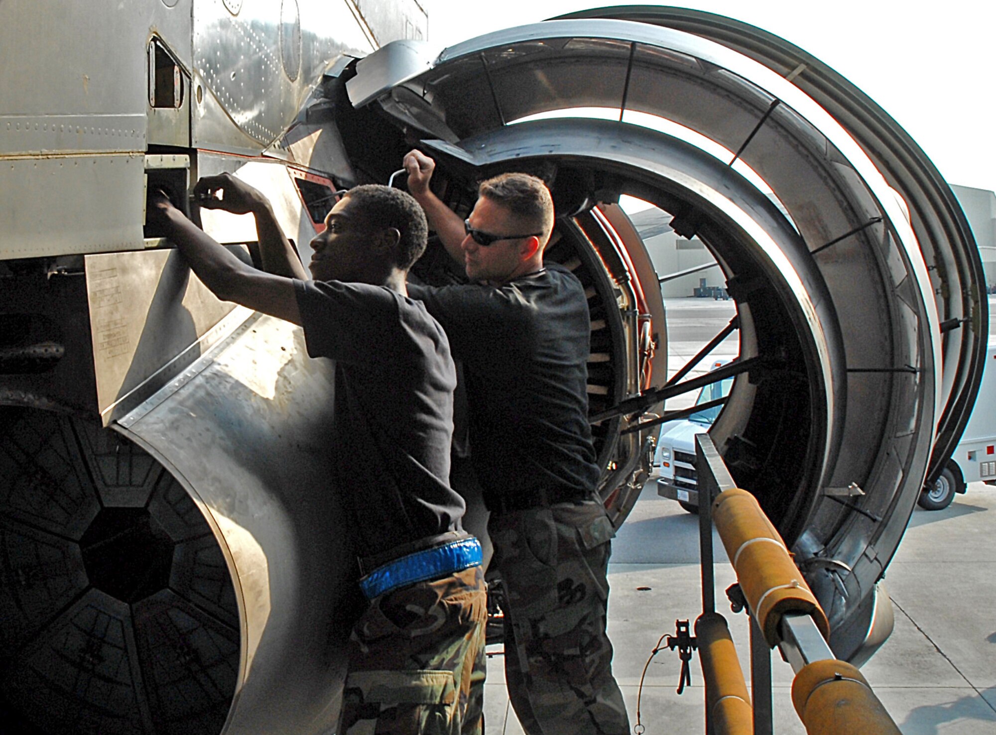 Senior Airman Vincent O'Hara, 437th Aircraft Maintenance Squadron aerospace propulsion specialist, and Tech. Sgt. Ian Kent, 437 AMXS aerospace propulsion specialist lead technician, actuate an engine thrust reverser of a Charleston C-17 on the flightline June 6.(U.S. Air Force photo/Airman 1st Class John White)
