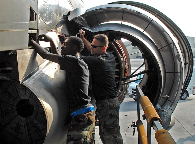 Senior Airman Vincent O'Hara, 437th Aircraft Maintenance Squadron aerospace propulsion specialist, and Tech. Sgt. Ian Kent, 437 AMXS aerospace propulsion specialist lead technician, actuate an engine thrust reverser of a Charleston C-17 on the flightline June 6.(U.S. Air Force photo/Airman 1st Class John White)