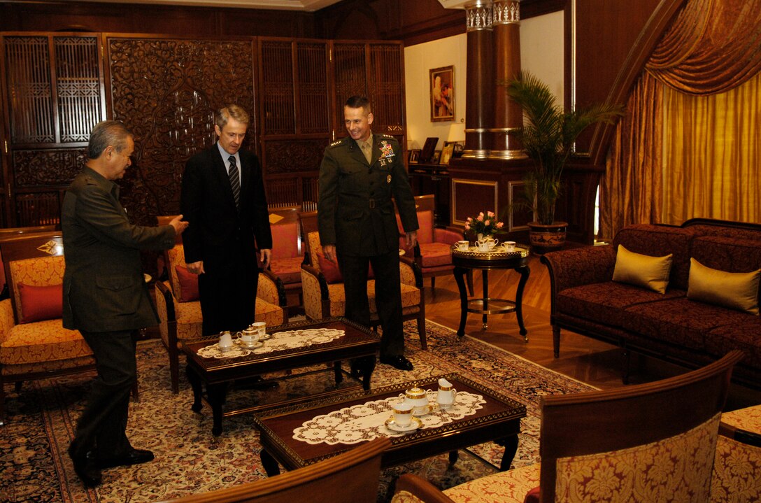 Prime Minister of Malaysia Abdullah Ahmad Badawi invites Ambassador Christopher LaFleur and Chairman of the Joint Chiefs of Staff U.S. Marine Gen. Peter Pace to take a seat in his office at the beginning of their meeting in Putrajaya, Malaysia, June 4, 2007. The chairman visited Malaysia to help further military to military relations between the United States and Malaysia.   Defense Dept. photo by U.S. Air Force Staff Sgt. D. Myles Cullen 