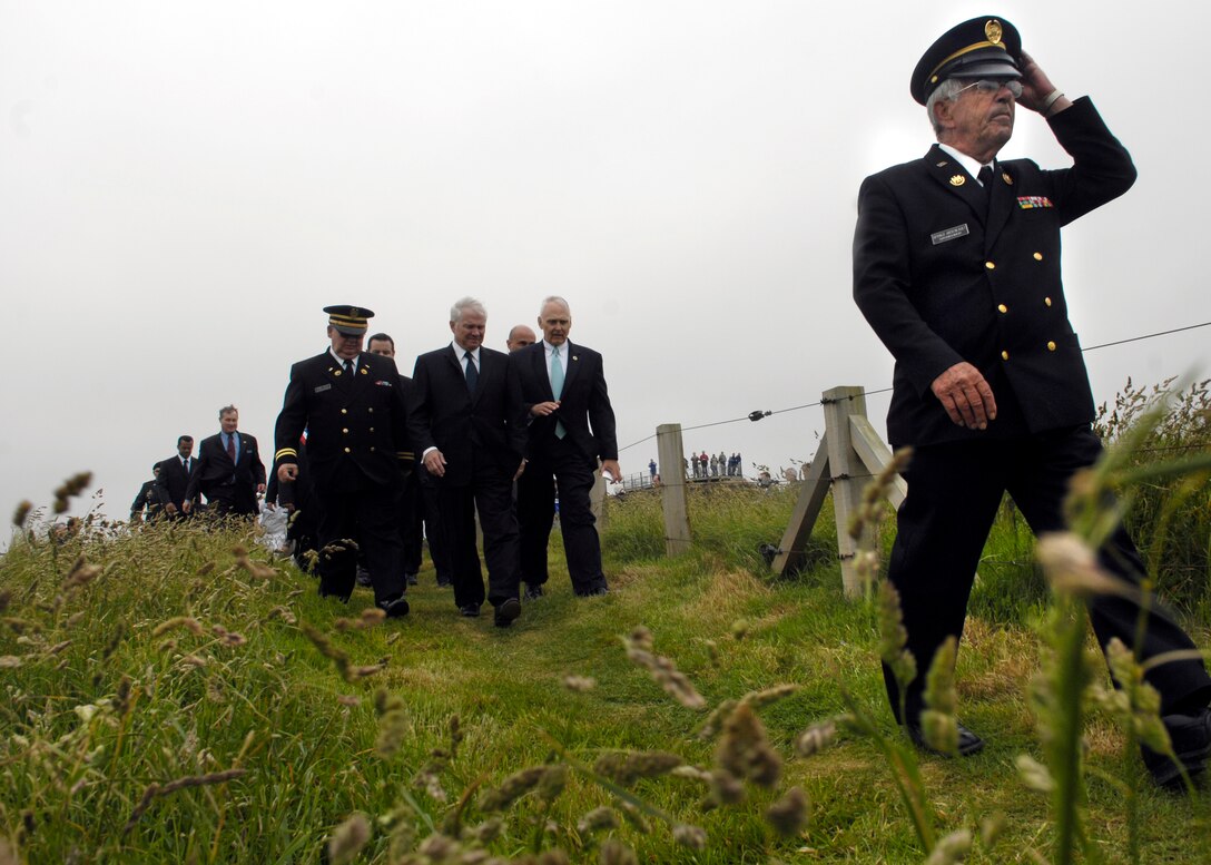 Secretary of Defense Robert M. Gates tours Point du Hoc on the 63rd Anniversary of D-Day in Normandy, France, June 6, 2007. During World War II, rangers assulted the beaches at Point du Hoc and scaled the 100-meter-high cliffs to defeat the enemy for the cause of freedom.