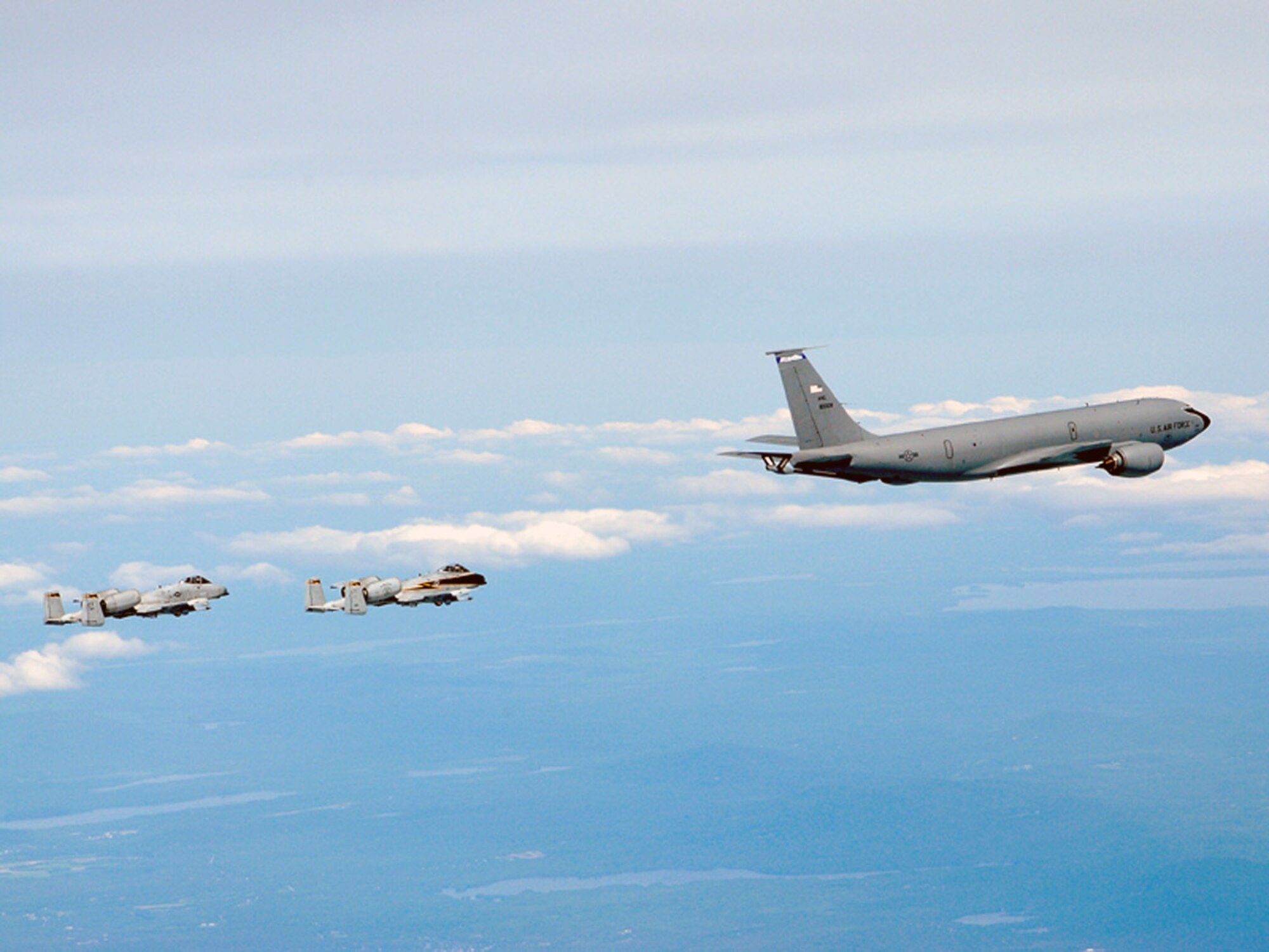 Two A-10 Thunderbolt IIs from the Connecticut Air National Guard's 103rd Fighter Wing fly in formation behind a KC-135 Stratotanker from the New Hampshire Air National Guard's 157th Air Refueling Wing during a special event held June 6 to promote Air Force Week New England which will take place in August.  (U.S. Air Force photo/Senior Master Sgt. Robert Sabonis)