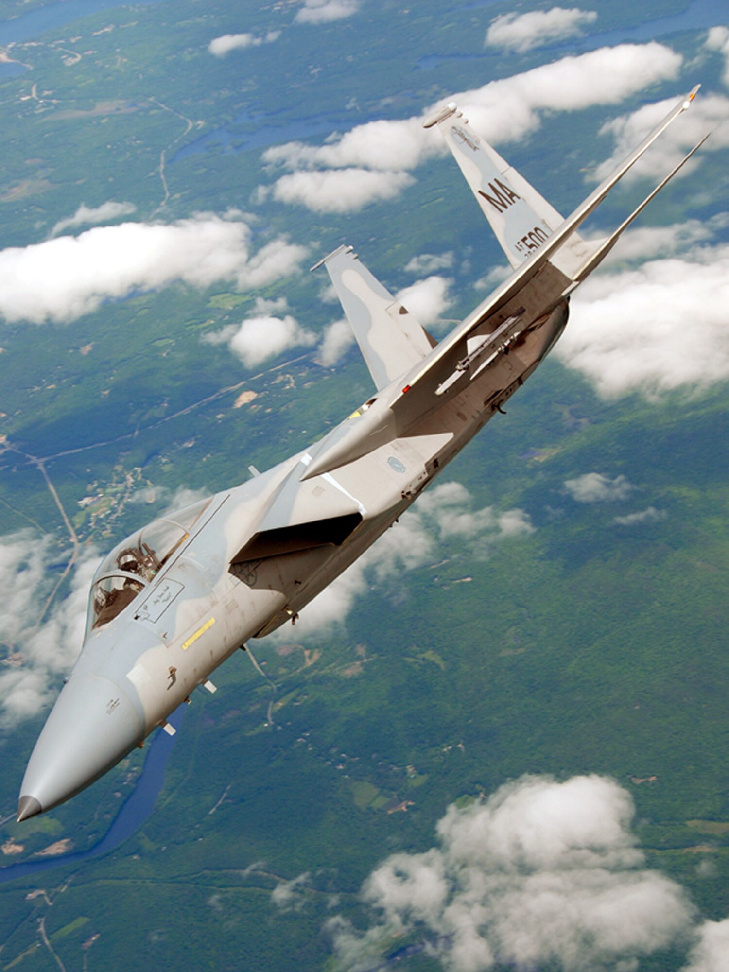 An F-15 Eagle from Otis Air National Guard Base, Mass., breaks off after refueling during a special event held June 6 to promote Air Force Week New England which will take place in August.  (U.S. Air Force photo/Senior Master Sgt. Robert Sabonis)