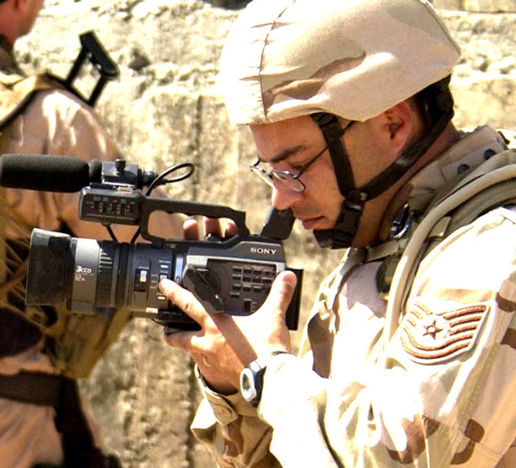 Tech. Sgt. Gary Burdett is the Defense Department's Military Videographer of the Year for 2007. Pictured here during his tour in Iraq in 2006, Burdett is a member of 1st Combat Camera Squadron at Charleston Air Force Base, S.C. (Defense Department photo) 
