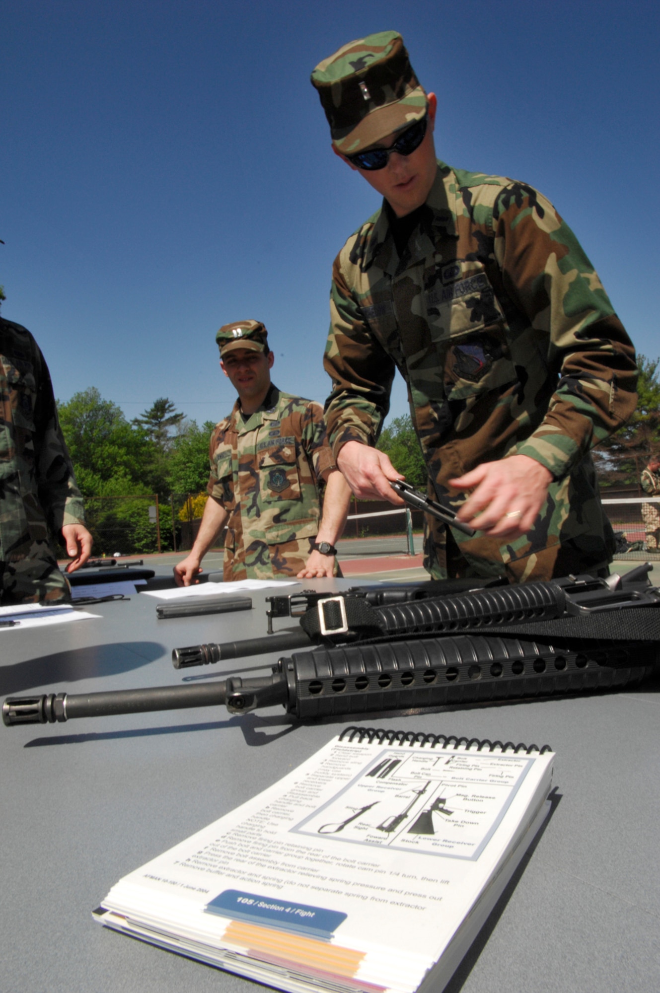 HANSCOM AFB, Mass. -- A Hanscom Airman disassembles an M-16 rifle during the “Iron Warrior” Olympics May 30. The event was held to help prepare base personnel for the upcoming Operational Readiness Inspection. (U.S. Air Force photo by Mark Wyatt)