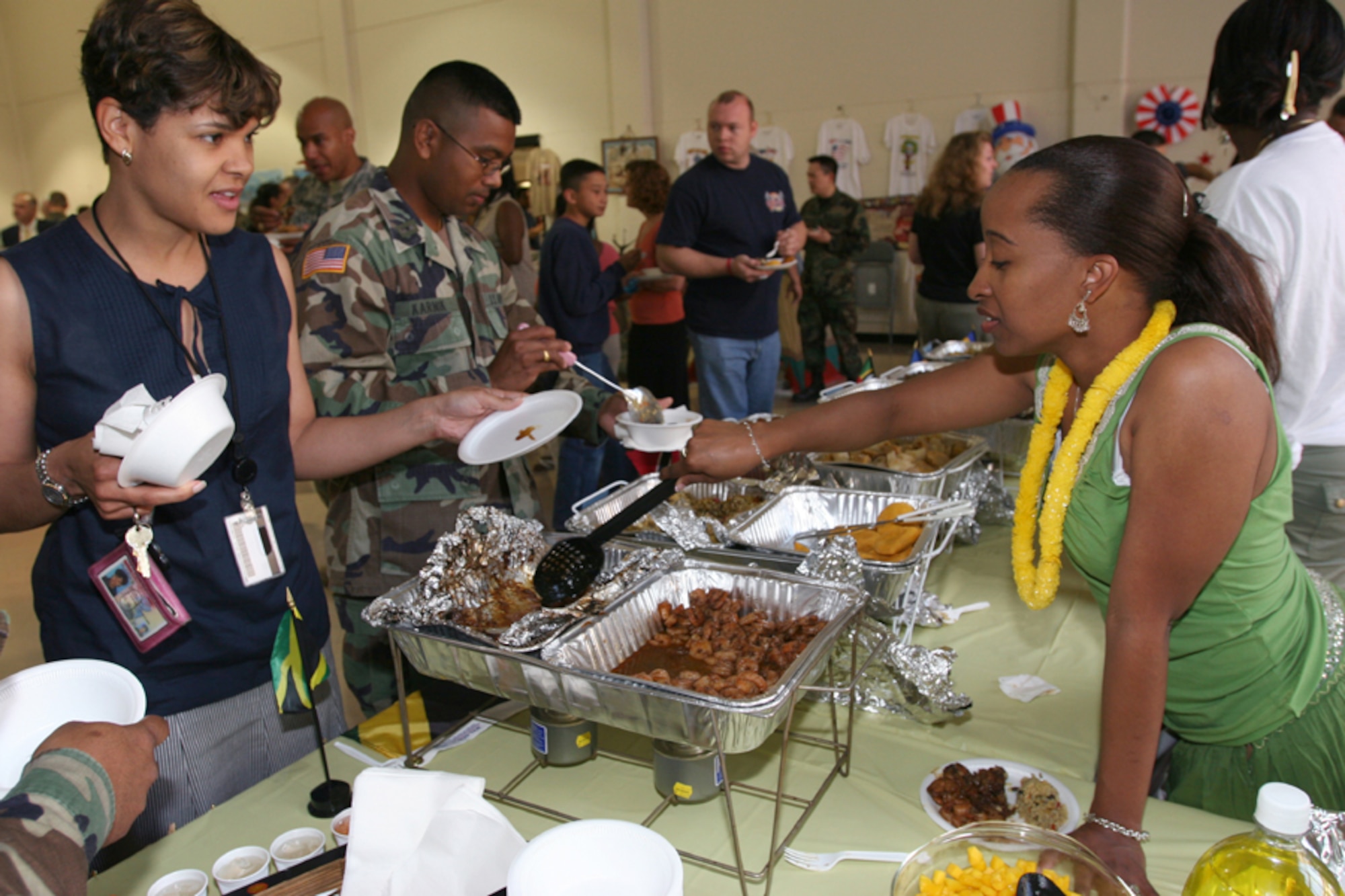 Guests enjoy the food at last year’s Unity Day held by the New Jersey National Guard. This year’s event, themed “Many Cultures, One Flag”, is set for Thursday, 11:30 a.m. to 3:30 p.m., in Bldg 3601, the Training Battle Lab, at Fort Dix. The ninth annual event will celebrate ethnic diversity through music, food and dance and will feature sample foods from around the globe, prepared with authentic ingredients, and entertainment from around the world provided by United We Sing, Red Hawk Indian Dancers, Voices of Africa, NJNG Youth Challenge Drill Team, Rancocas Valley Regional High School Hollywood Steppers and the O’Leary Irish Dancers. Guests will also have the opportunity to win a weekend package to the Poconos. For more information, call Capt. Lola Washinton at (609) 562-0856. (Courtesy photo)