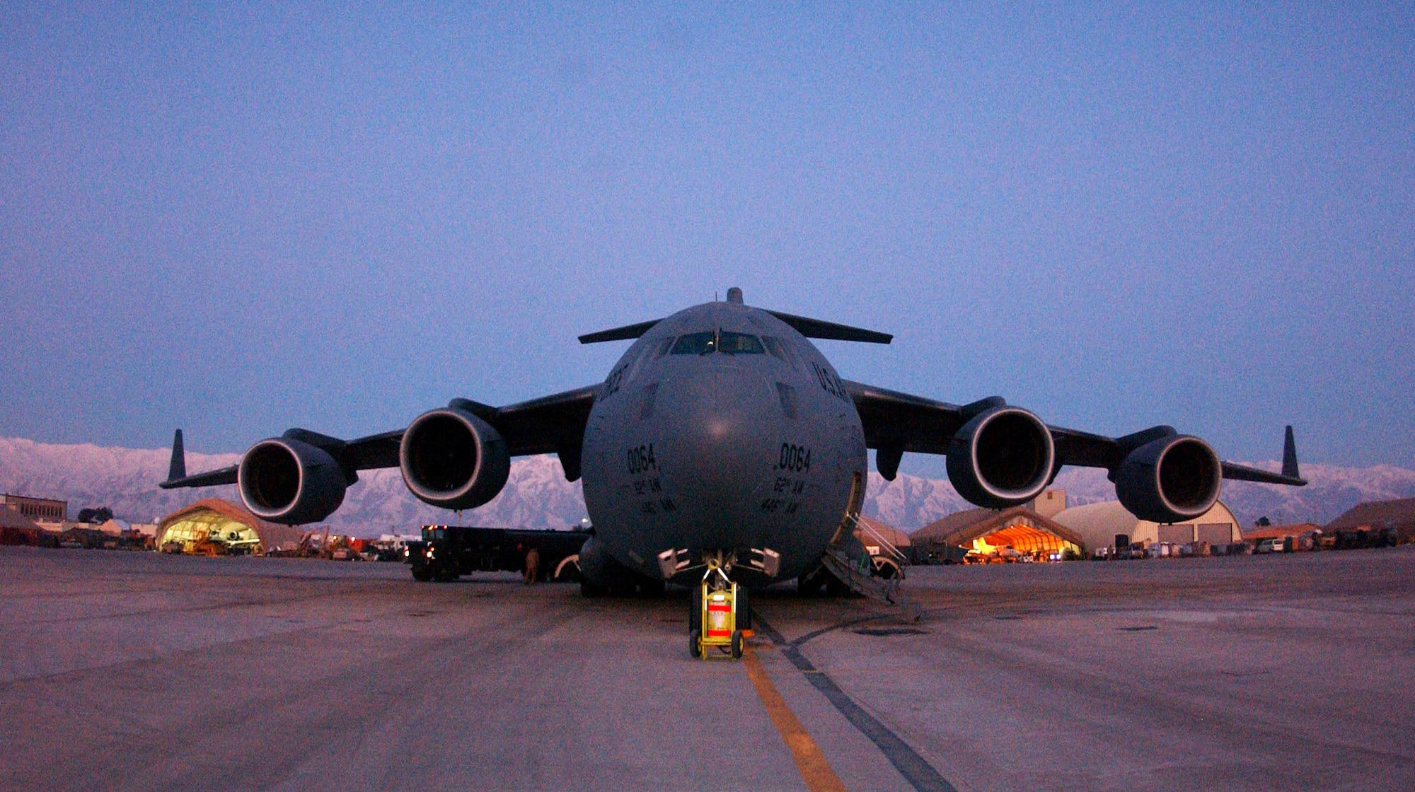 An Air Force C-17 Globemaster III awaits its next mission at a base in Southwest Asia.  Coalition C-17s and C-130 Hercules aircraft flew 132 airlift sorties June 7 and delivered 1.5 million pounds of cargo.  (U.S. Air Force photo.)

