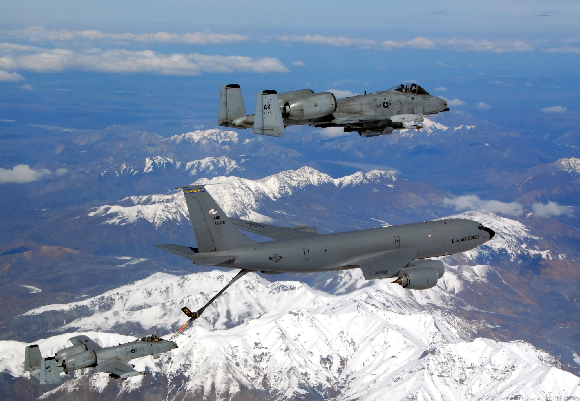 A KC-135 Stratotanker from the Alaska Air National Guard's 168th Air Refueling Wing flies in formation with two A-10 Thunderbolt IIs from the 355th Fighter Squadron May 29 over Alaska. The three aircraft assigned to Eielson Air Force Base, Alaska, flew in formation for the last time due to the deactivation of the 355th FS. (U.S. Air Force photo/Master Sgt. Rob Wieland)
