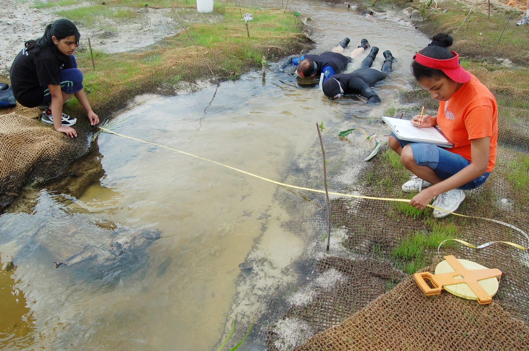 EGLIN AIR FORCE BASE, Fla. -- Seven students from the Young Women's Leadership School in Harlem, N.Y., assisted in various aspects of the Mill Creek stream restoration project at Eglin Air Force Base, Fla., in April. The students planted vegetation, measured the width of the stream and depicted the stream's features on grid paper. (U.S. Air Force photo by Jerron Barnett)