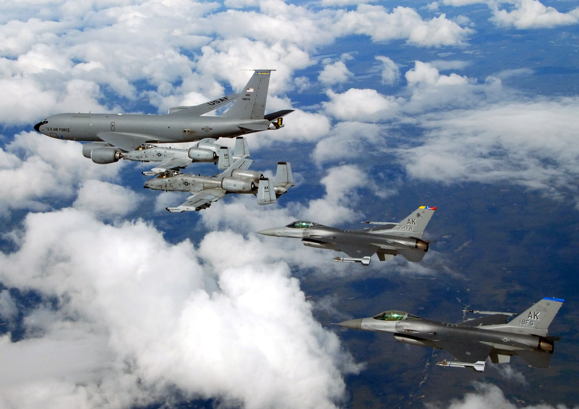 A KC-135 Stratotanker with the Alaska Air National Guard's 168th Air Refueling Wing  flies with two F-16 Fighting Falcons from the 18th Fighter Squadron and two A-10 Thunderbolt IIs from the 355th Fighter Squadron May 29 over Alaska. The five aircraft assigned to Eielson Air Force Base, Alaska, flew in formation for the last time due to the deactivation of the 18th and 355th Fighter Squadrons. (U.S. Air Force photo/Master Sgt. Rob Wieland)

